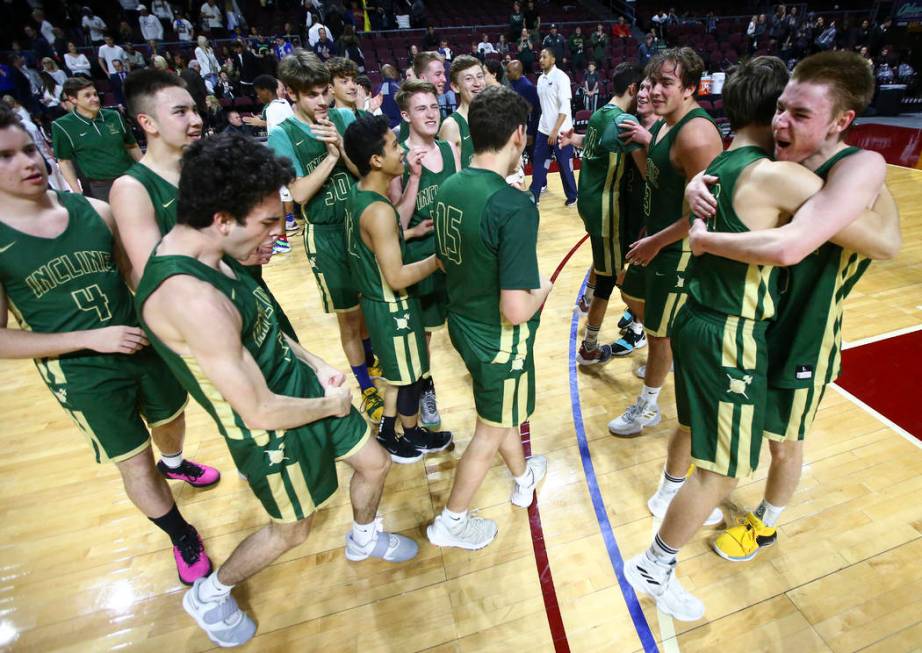 Incline players celebrate their win over The Meadows in the Class 2A boys basketball state c ...