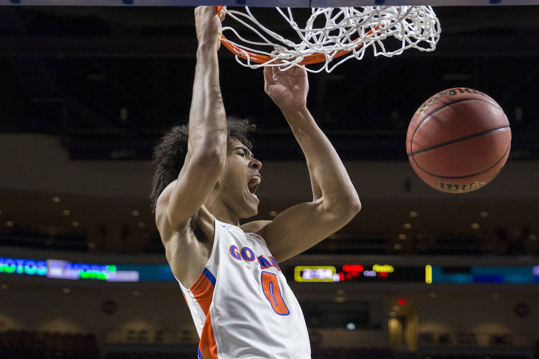 Bishop Gorman junior forward Isaiah Cottrell (0) converts a fast-break dunk in the fourth qu ...