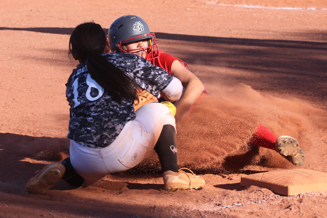 Liberty’s Jessica Meza (20) slides safe for a triple against Desert Oasis’ Jaid ...