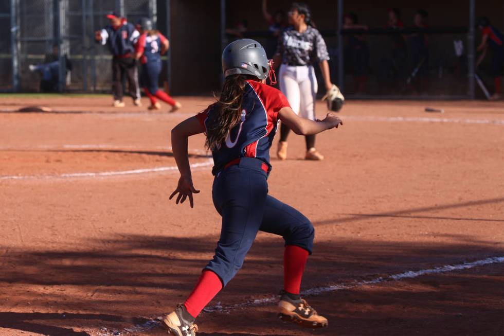 Liberty’s Jessica Meza (20) runs home for a run against Desert Oasis in the softball g ...