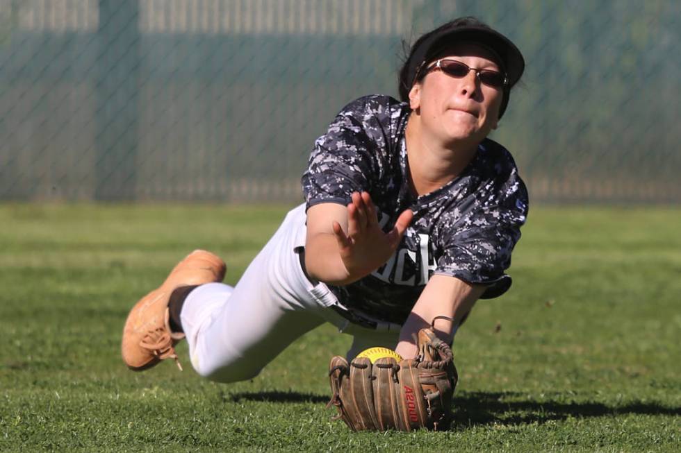 Desert Oasis’ Makayla Rickard (23) makes a diving catch for an out against Liberty in ...