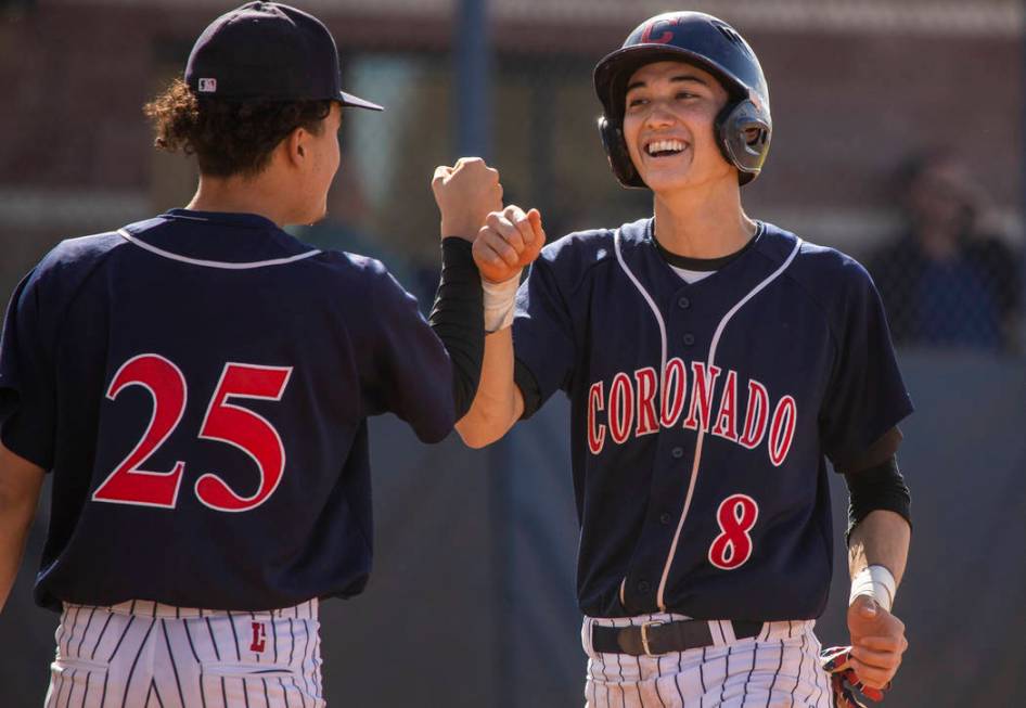 Coronado’s Thomas Planellas (25) congratulates teammate Jett Kenyon (8) after scoring ...