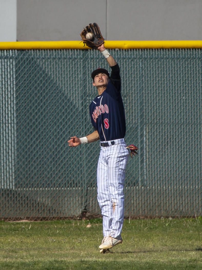 Coronado outfielder Jett Kenyon (8) elevates to make a deep catch versus Silverado during th ...