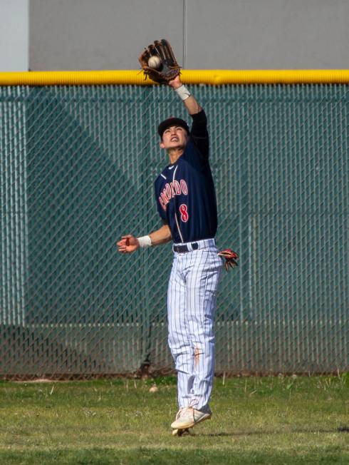 Coronado outfielder Jett Kenyon (8) elevates to make a deep catch versus Silverado during th ...