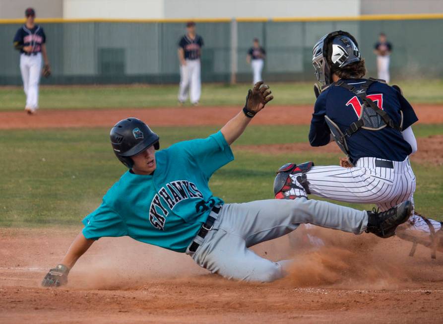 Silverado runner Sean Graves (35) slides safely into home past a late throw to Coronado catc ...