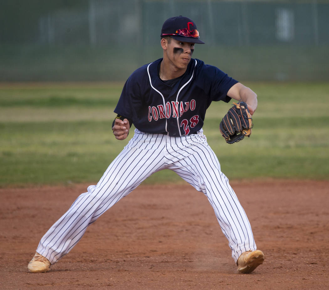 Coronado infielder Josh Johnson (28) grabs a tough hop from a Silverado batter during their ...