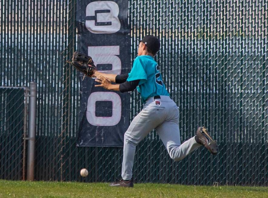 Silverado outfielder Ryeant Horacek (28) is unable to catch a long fly ball from a Coronado ...