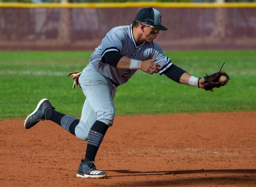 Palo Verde’s Paul Myro IV (23) scoops up a grounder from a Faith lutheran batter durin ...