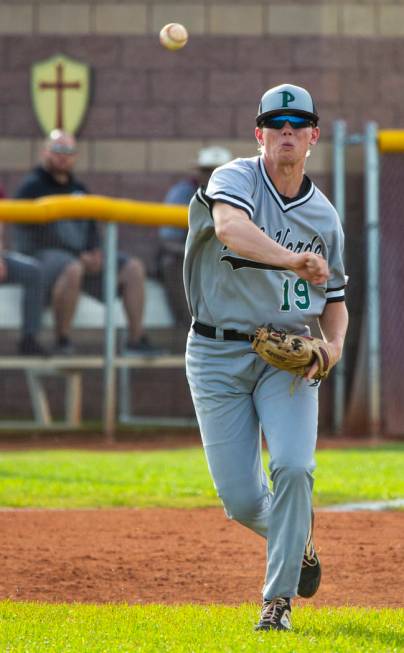 Palo Verde’s Bryce Robison (19) slings a ball to first base ahead of a Faith Lutheran ...