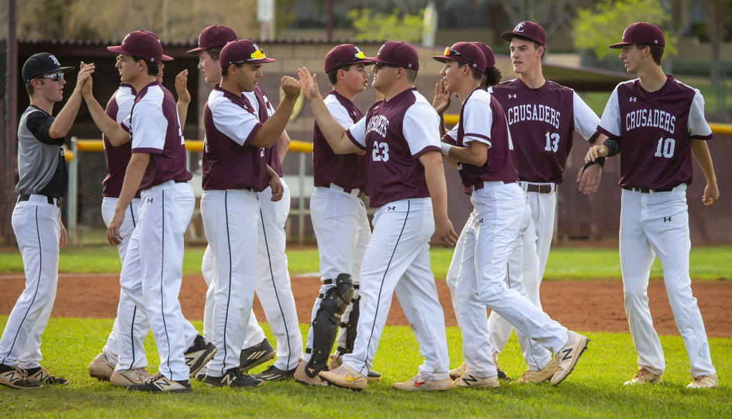 Faith Lutheran players celebrate their win over Palo Verde during their high school baseball ...