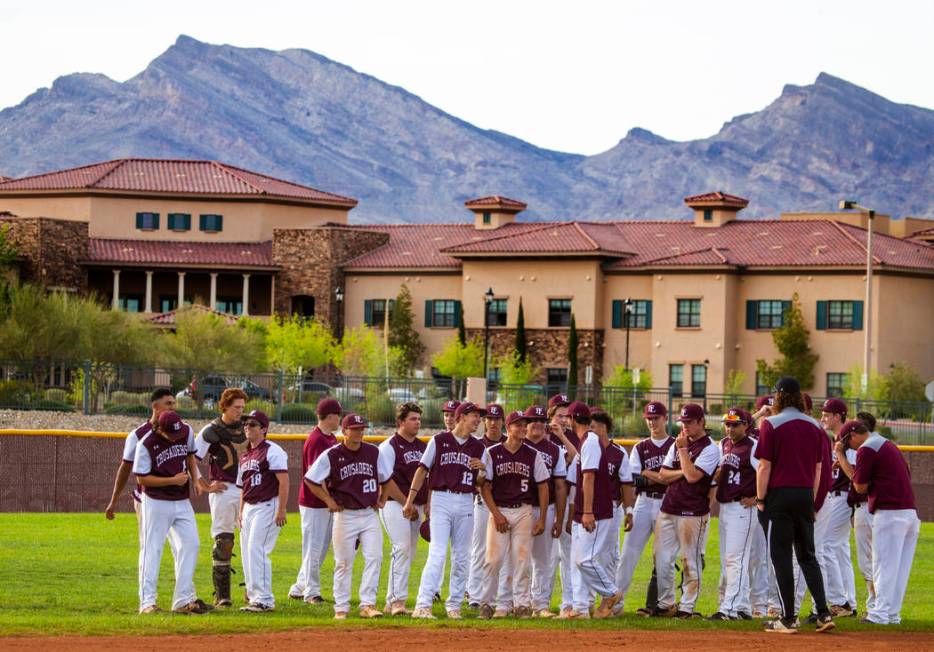 Faith Lutheran players come together and celebrate their win over Palo Verde during their hi ...