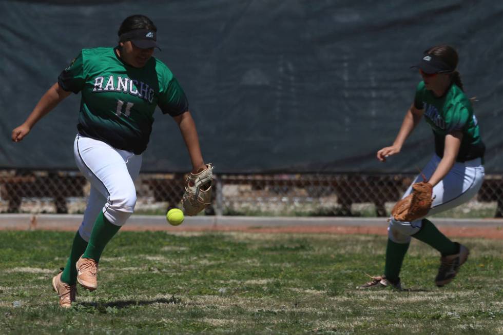 Ranchos’ Mia Elicerio (11) watches as the ball falls in the outfield for a Desert Oasi ...