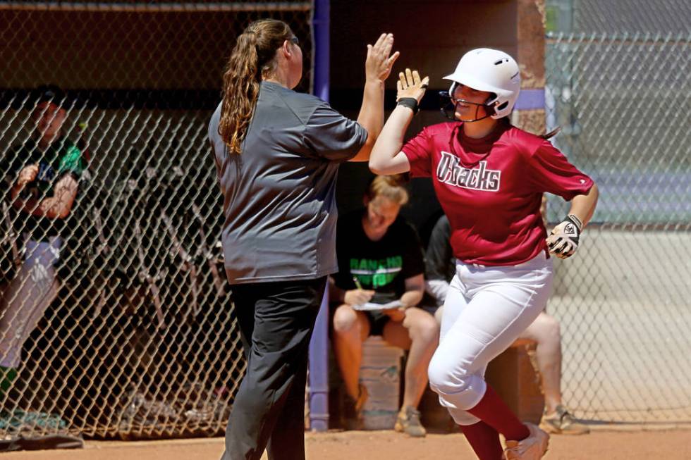 Desert Oasis Holly Severance (4) rounds the bases after a three-run homer against Rancho in ...