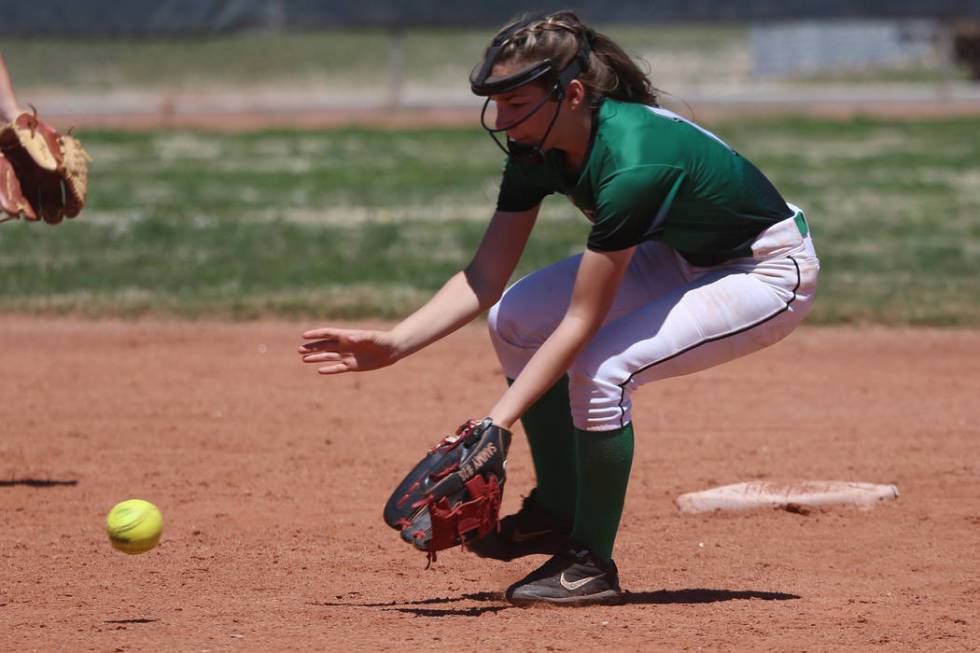 Rancho’s Samantha Whalen (10) picks up a ground ball against Desert Oasis in the softb ...