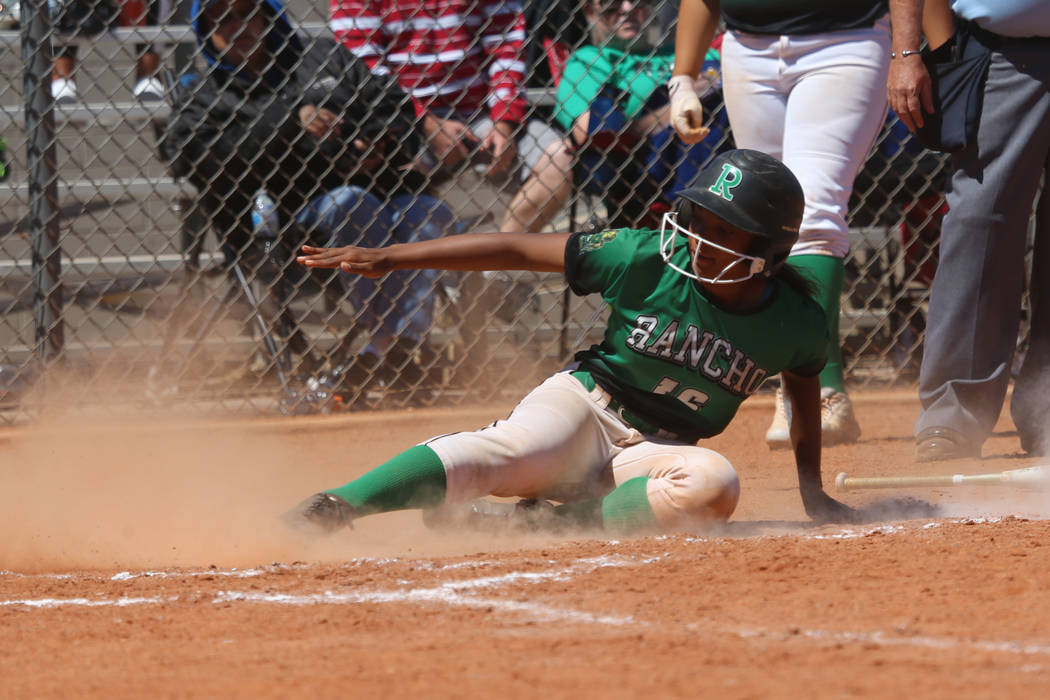 Rancho’s Anaiya Irick (16) slides home for a run against Desert Oasis in the softball ...