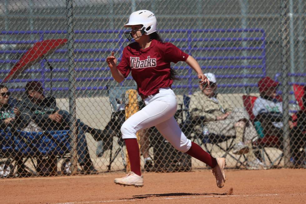 Desert Oasis Ruby Martinez (10) runs home for a run against Rancho in the softball game at D ...