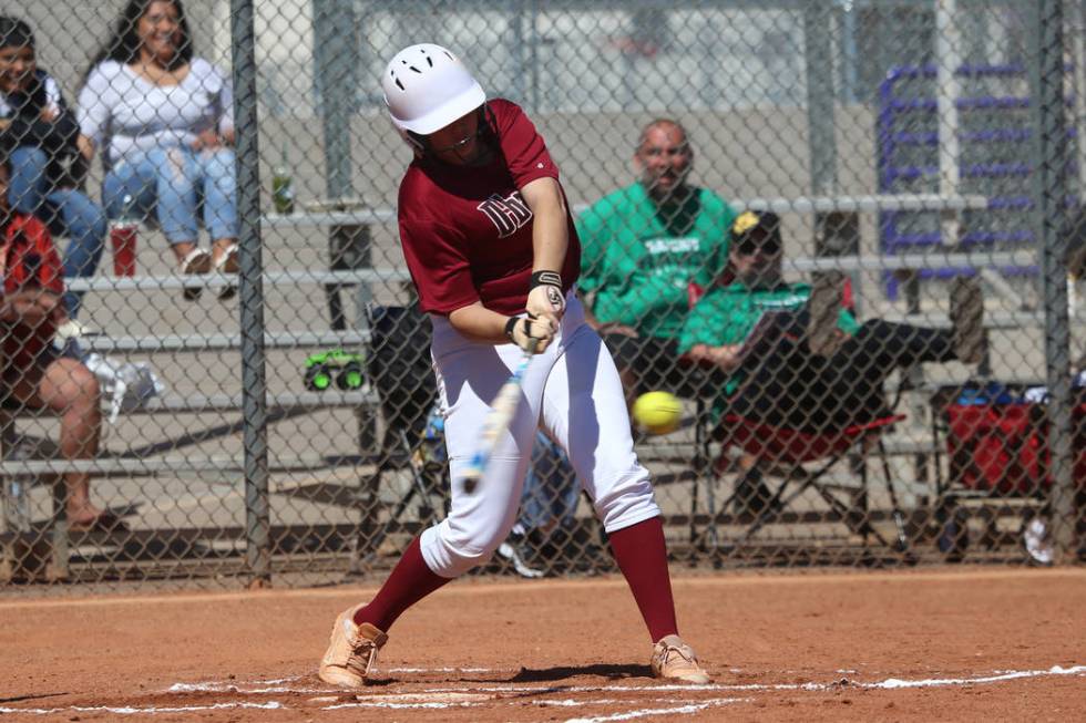 Desert Oasis Holly Severance (4) hits a two-run double against Rancho in the softball game a ...