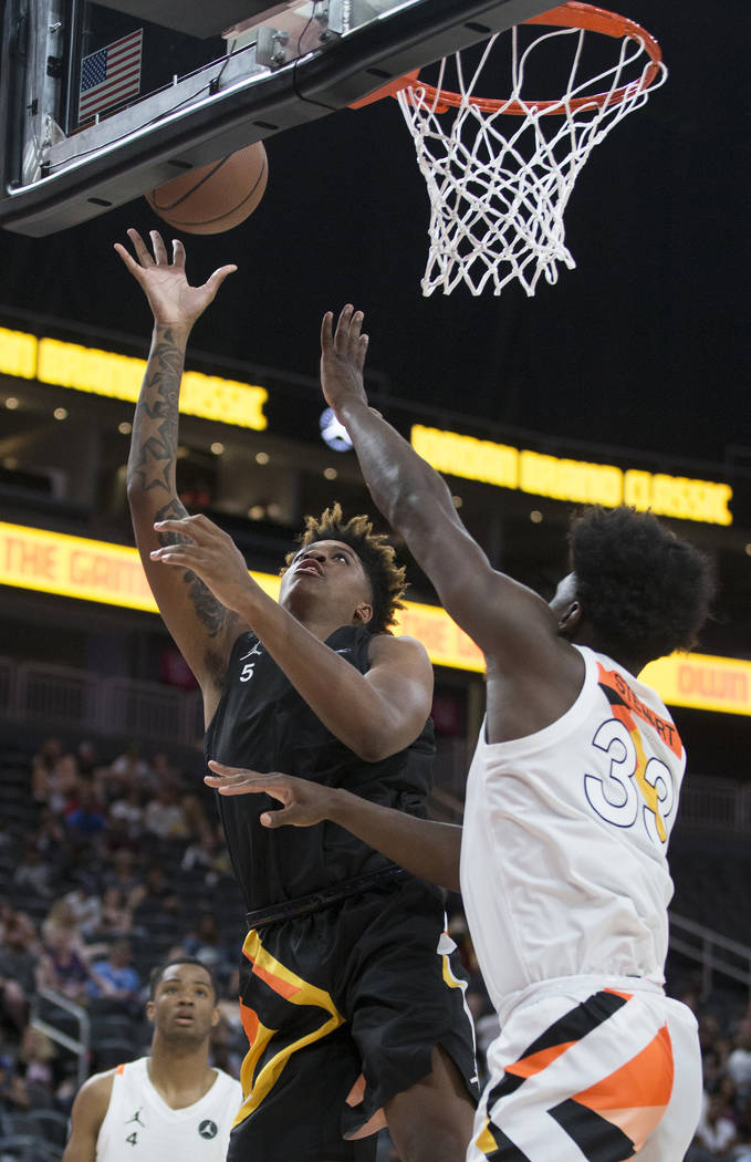 Armando Bacot Jr. shoots over Isaiah Stewart (33) in the first half during the Jordan Brand ...