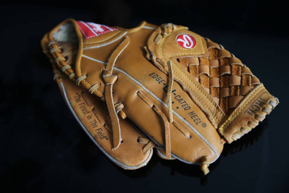 At the home of Chris Jachimiec, a baseball glove that belonged to his brother Adam, Friday, Mar ...