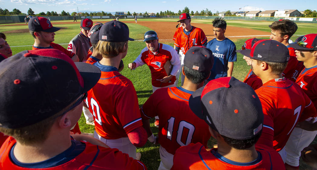 Liberty head coach Rich Ebarb motivates his players late in the game during a time out versu ...