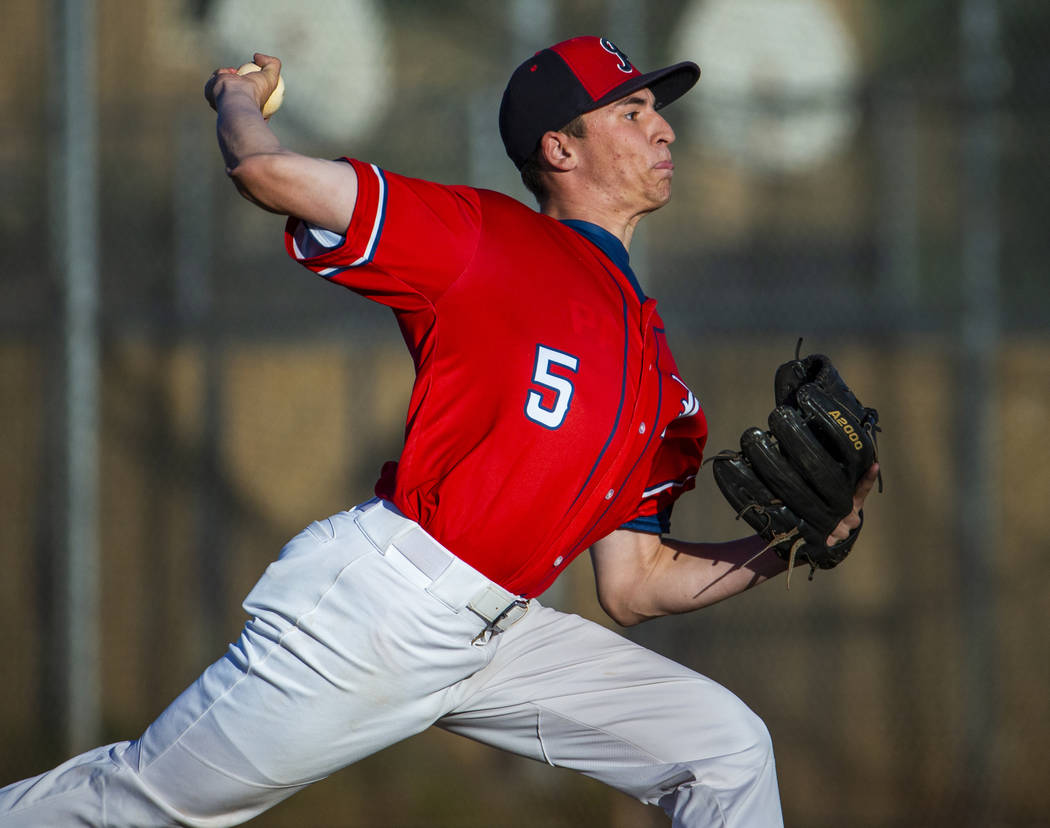 Liberty’ pitcher Garrett Maloney (5) finishes off Spring Valley during the first round ...