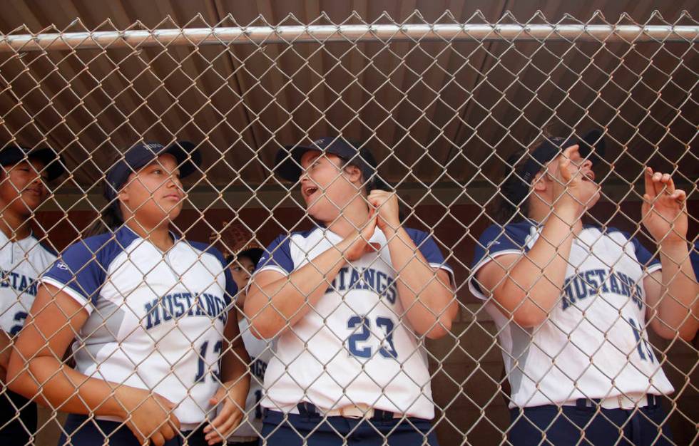 Shadow Ridge High School players Mikayla Brown (13), Alexis Toia (23), and Tori Nichols (16) ...