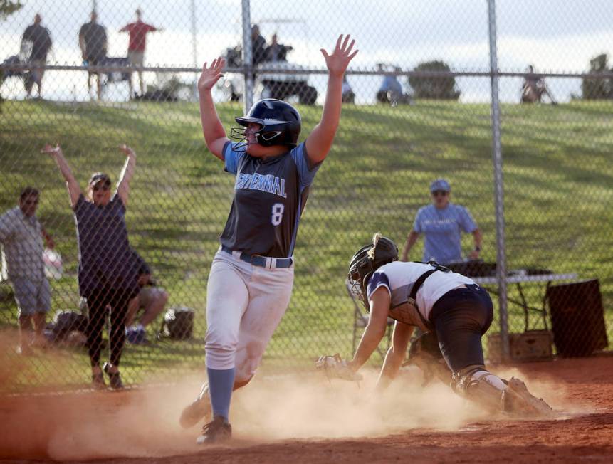 Centennial High School’s Ashlynn Heck (8) makes a home run, winning the game 3-2 again ...