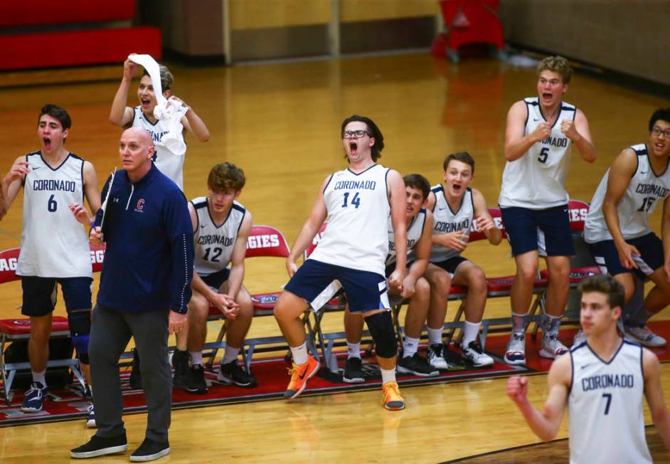 Coronado players, including Brian Wightman (14), celebrate after winning a set during the De ...