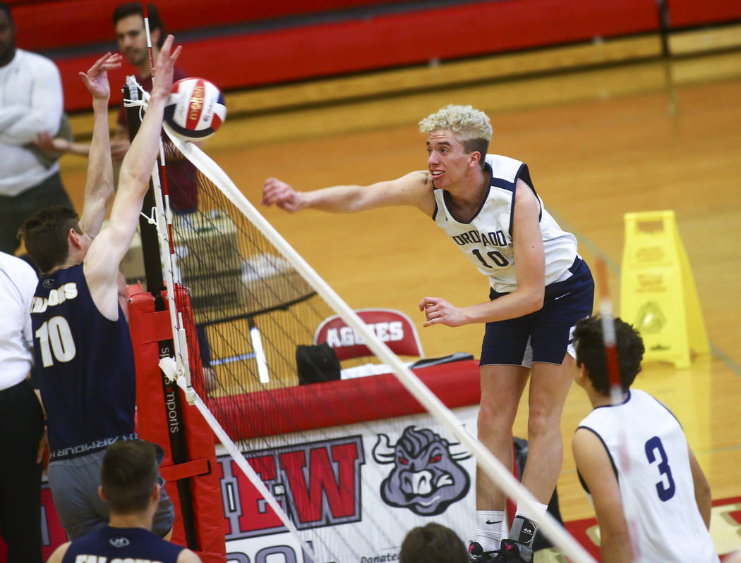 Foothill’s Caleb Stearman (10) blocks a shot from Coronado’s Randy Cowles (10) d ...