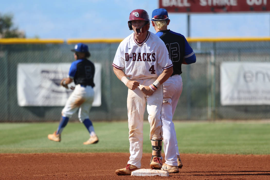 Desert Oasis’ Parker Schmidt (4) reacts after hitting a double against Basic in the De ...