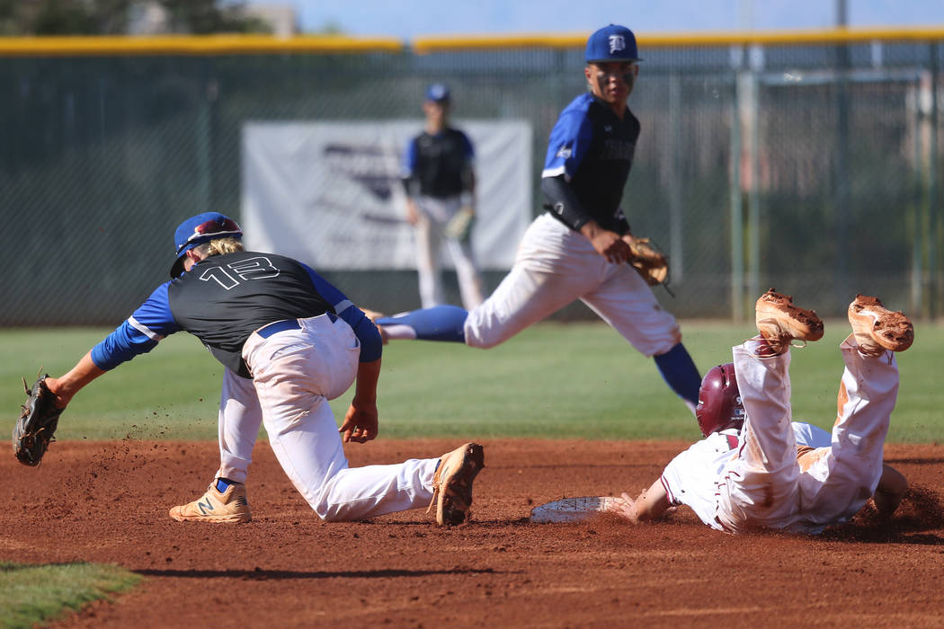 Desert Oasis’ Colby Smith (10) steals second base safely against Basic’s Dalton ...