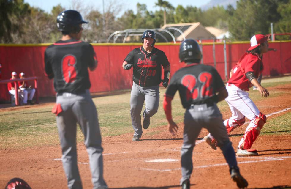 Las Vegas’ first baseman Trevor Johnson (20) scores a run during a baseball game at Ar ...