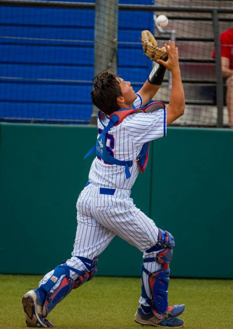 Reno catcher Lane Oliphant (28) pulls in an infield fly ball versus Las Vegas during their s ...