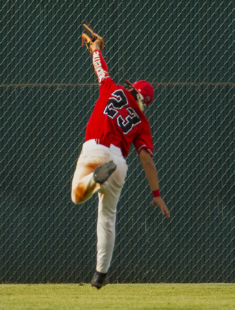 Las Vegas’ Dalton Silet (23) extends in the air to catch a long, fly ball in the outfi ...
