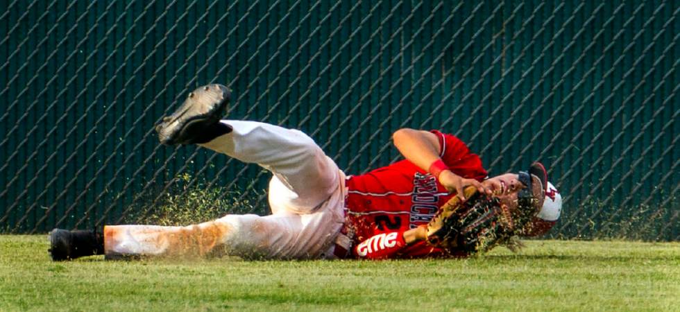 Las Vegas’ Dalton Silet (23) secures a long, fly ball catch in the outfield after a ci ...