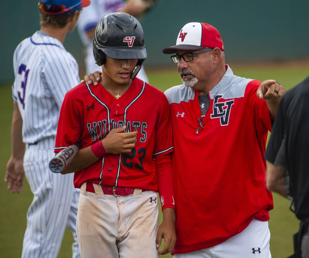 Las Vegas’ Dalton Silet (23) is counseled by head coach Sam Thomas during a time out v ...