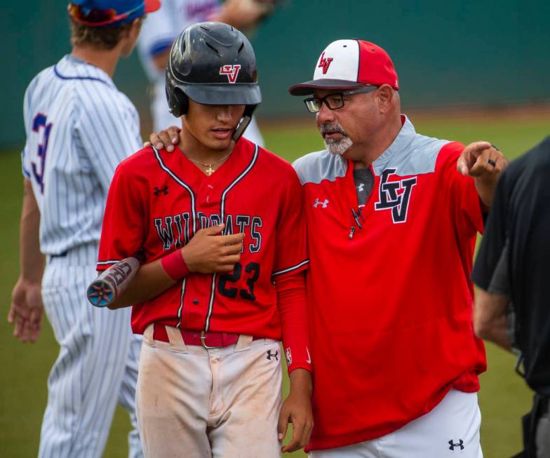 Las Vegas’ Dalton Silet (23) is counseled by head coach Sam Thomas during a time out v ...