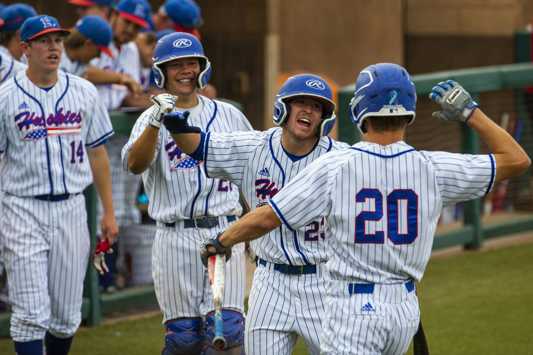 Reno players celebrate a score by teammate Coleman Schmidt (20) versus Las Vegas during thei ...