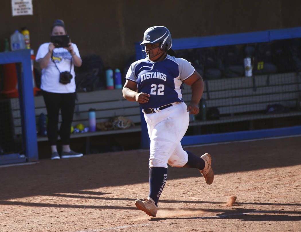 Shadow Ridge’s Alyssa Stanley (22) rounds the bases on her home run hit against McQuee ...