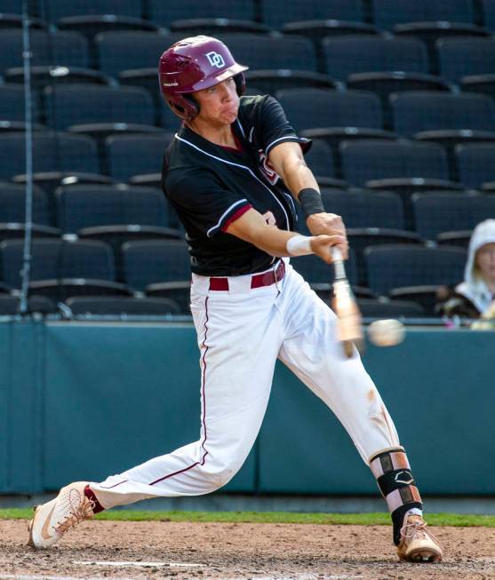 Desert Oasis’ Zac Czerniawski (8) connects on a pitch from Reno during their Class 4A ...