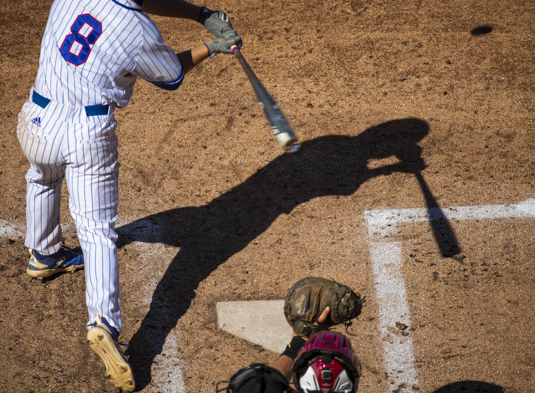 Reno batter Gunner Gouldsmith has his shadow cast on the infield as he faces a Desert Oasis ...