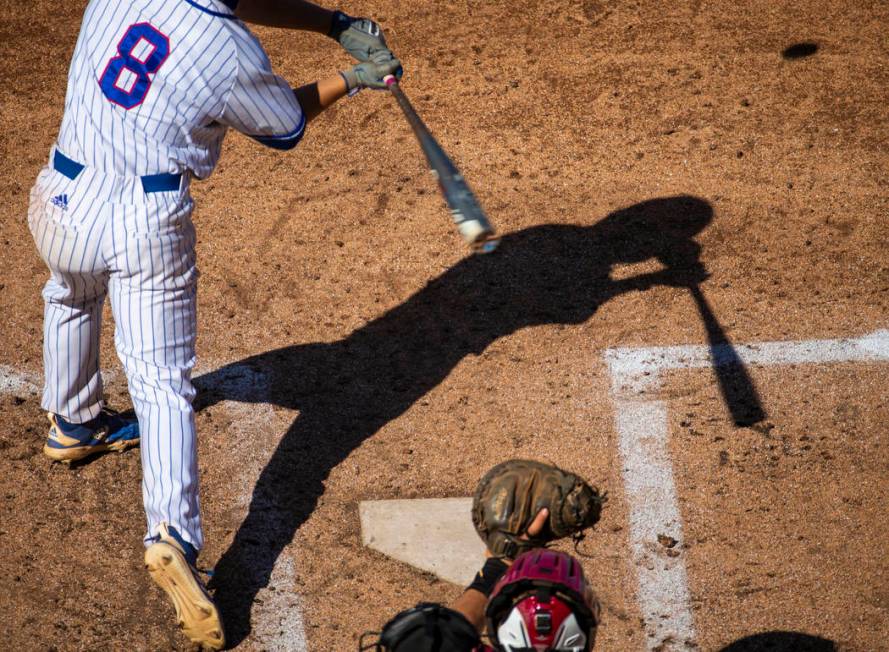 Reno batter Gunner Gouldsmith has his shadow cast on the infield as he faces a Desert Oasis ...