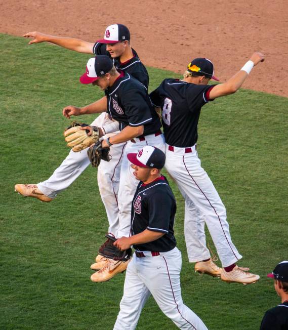 Desert Oasis players celebrate their win over Reno 8-6 following their Class 4A state baseba ...