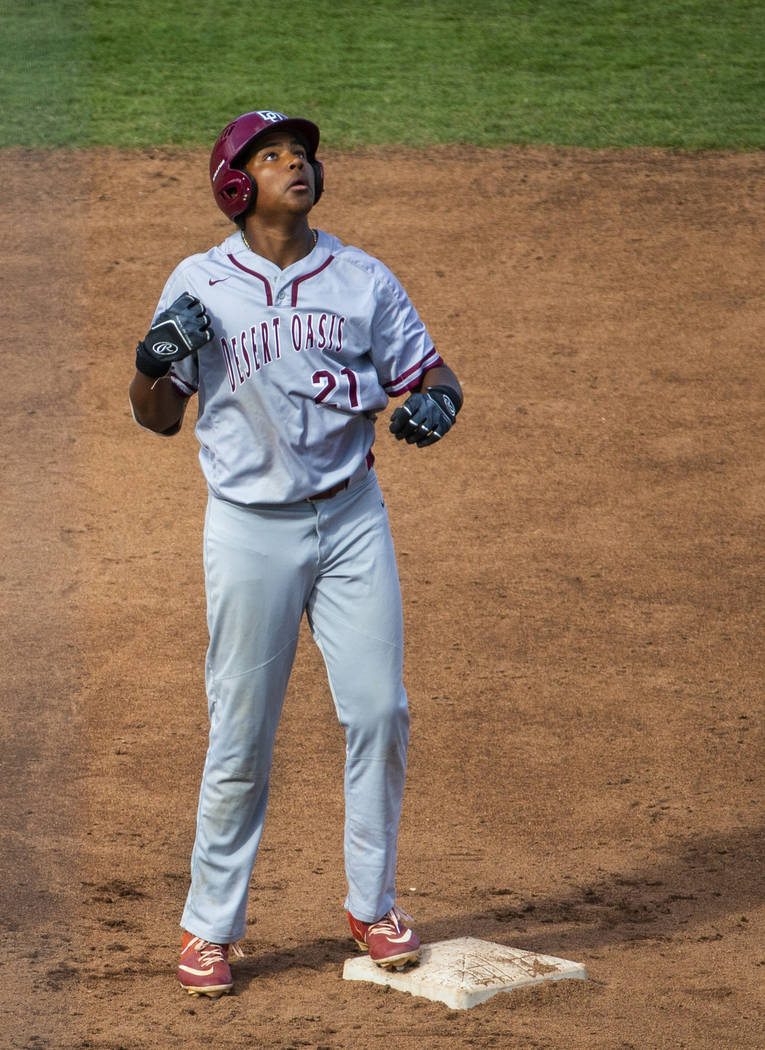 Desert Oasis runner Jacob Walsh (21) looks up at second base versus Reno in the second innin ...