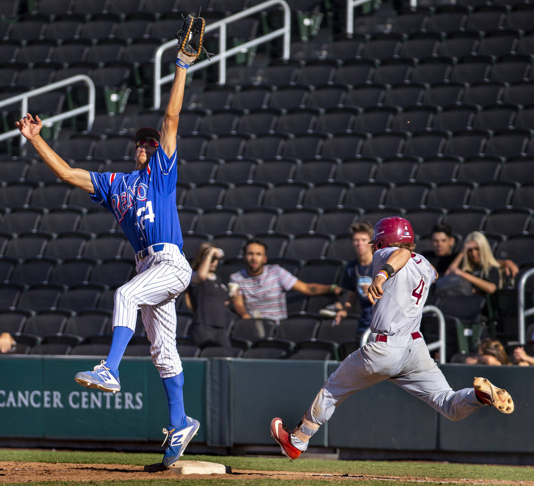 Reno’s Skylar Hales (24) extends for a tough catch at first base make the out over Des ...