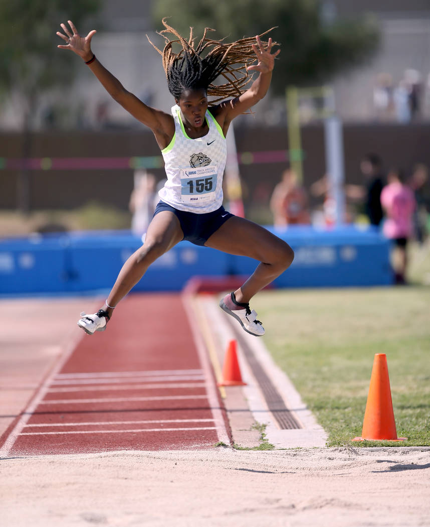 Ashley Moore of Centennial competes in the triple jump during the Class 4A state track meet ...
