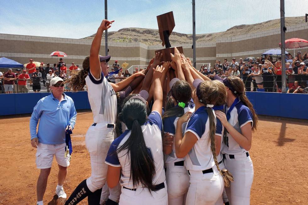 Shadow Ridge softball players hoist the Class 4A state championship trophy after winning the ...