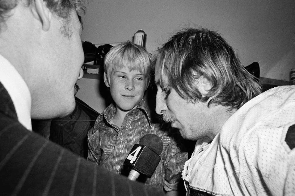 Ten-year-old Fred Biletnikoff Jr., center, looks in admiration at his father, one of the sta ...