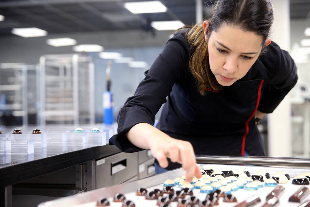 Melissa Coppel prepares a display of student-created chocolates at her Las Vegas chocolate scho ...