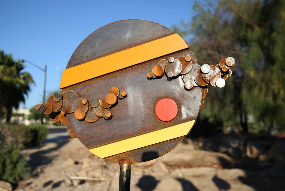 Artist Randy Mendre's sculpture "Solar Walk" is displayed at at the corner of North B ...